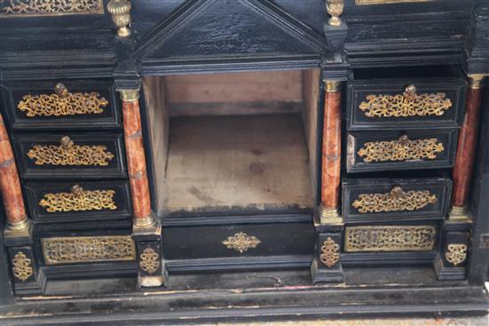 A 19th century Flemish ebonised table cabinet, 21in.
